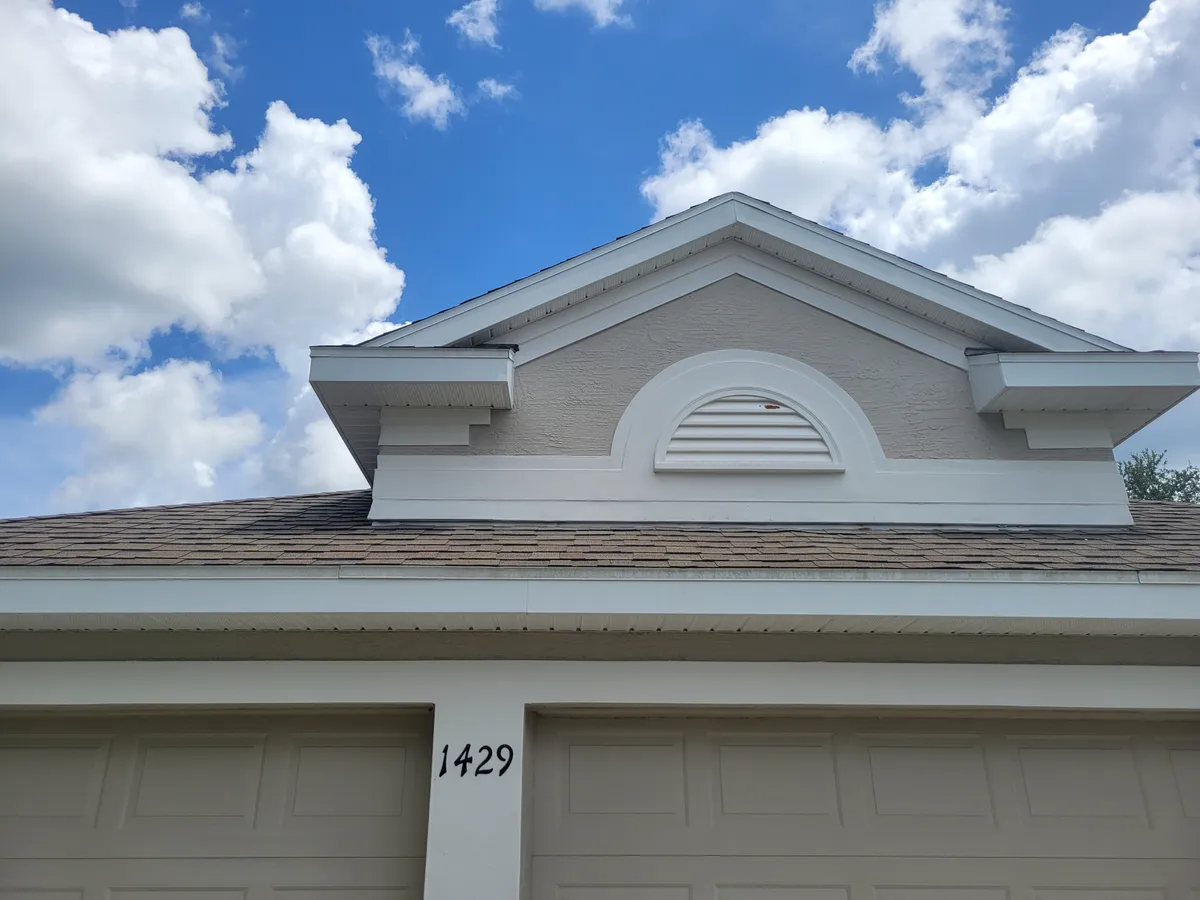 After: Full exterior soft wash on a two-story home. Algae and mildew buildup gone.