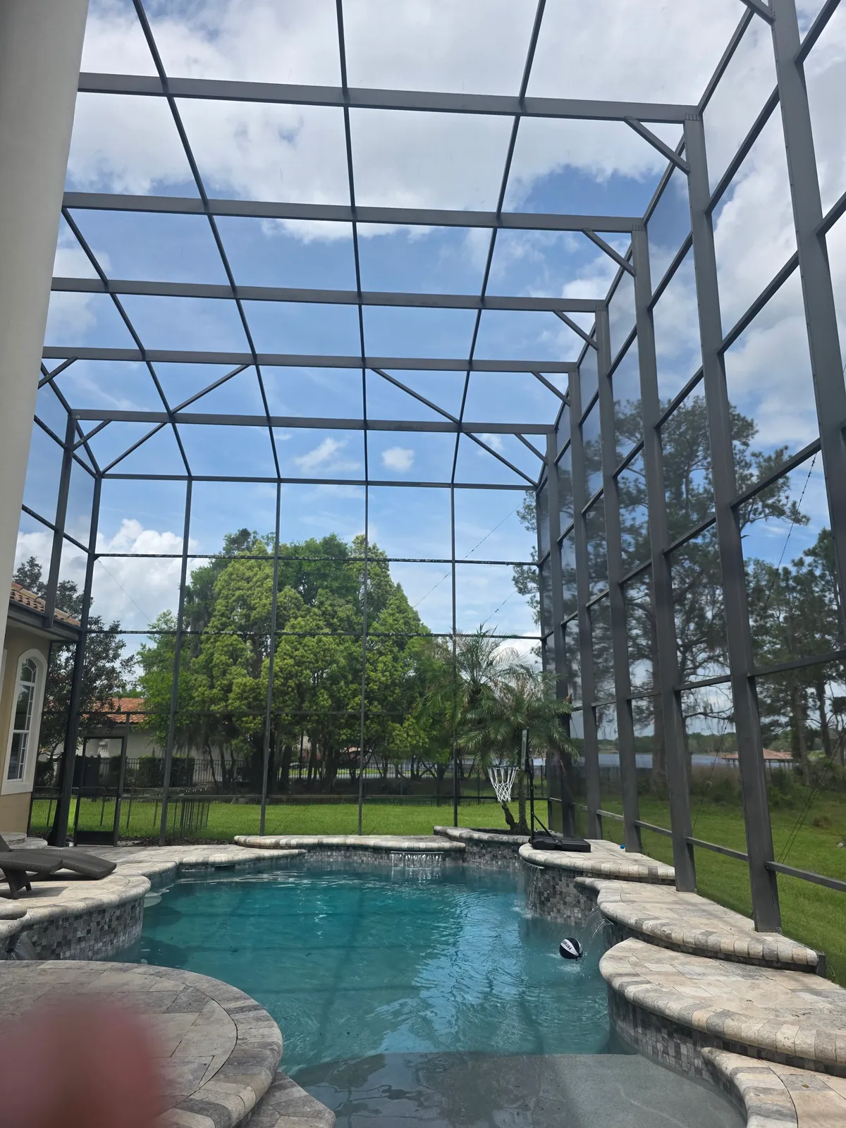 After: Every screen panel and aluminum frame scrubbed clean. Pool area looks new again.